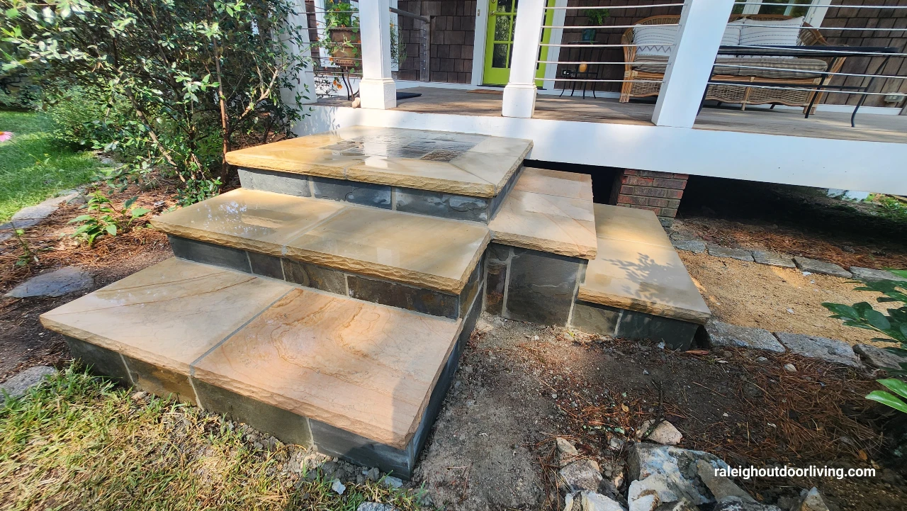 Stairs rebuilt with natural stone treads and stone veneer. 